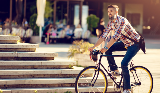 man riding bike in the sun