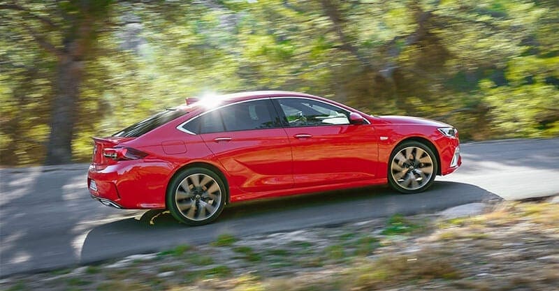 A Vauxhall Insignia driving through trees