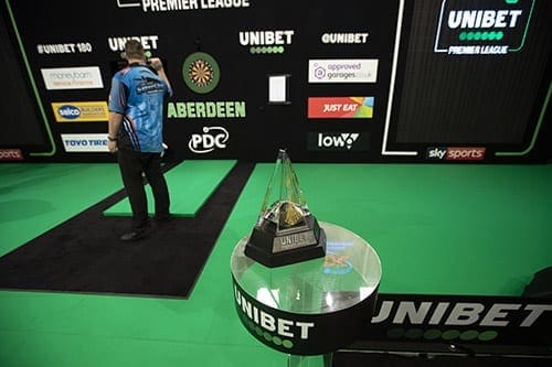 Lawrence Lustig playing darts