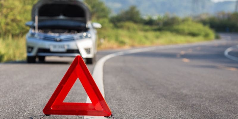 Car with red emergency triangle