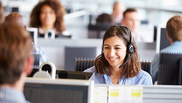 A lady on the phone in a call centre