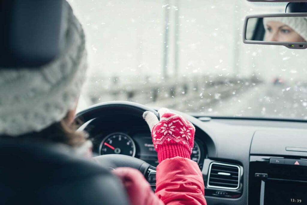 woman-driving-car-in-winter