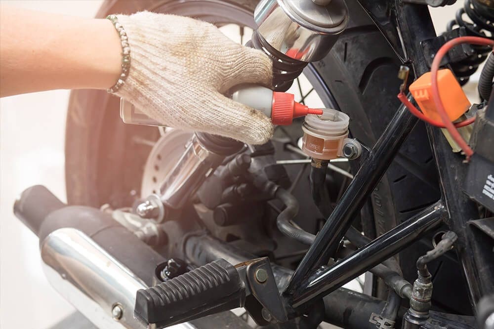 Filling up a motorbikes oil