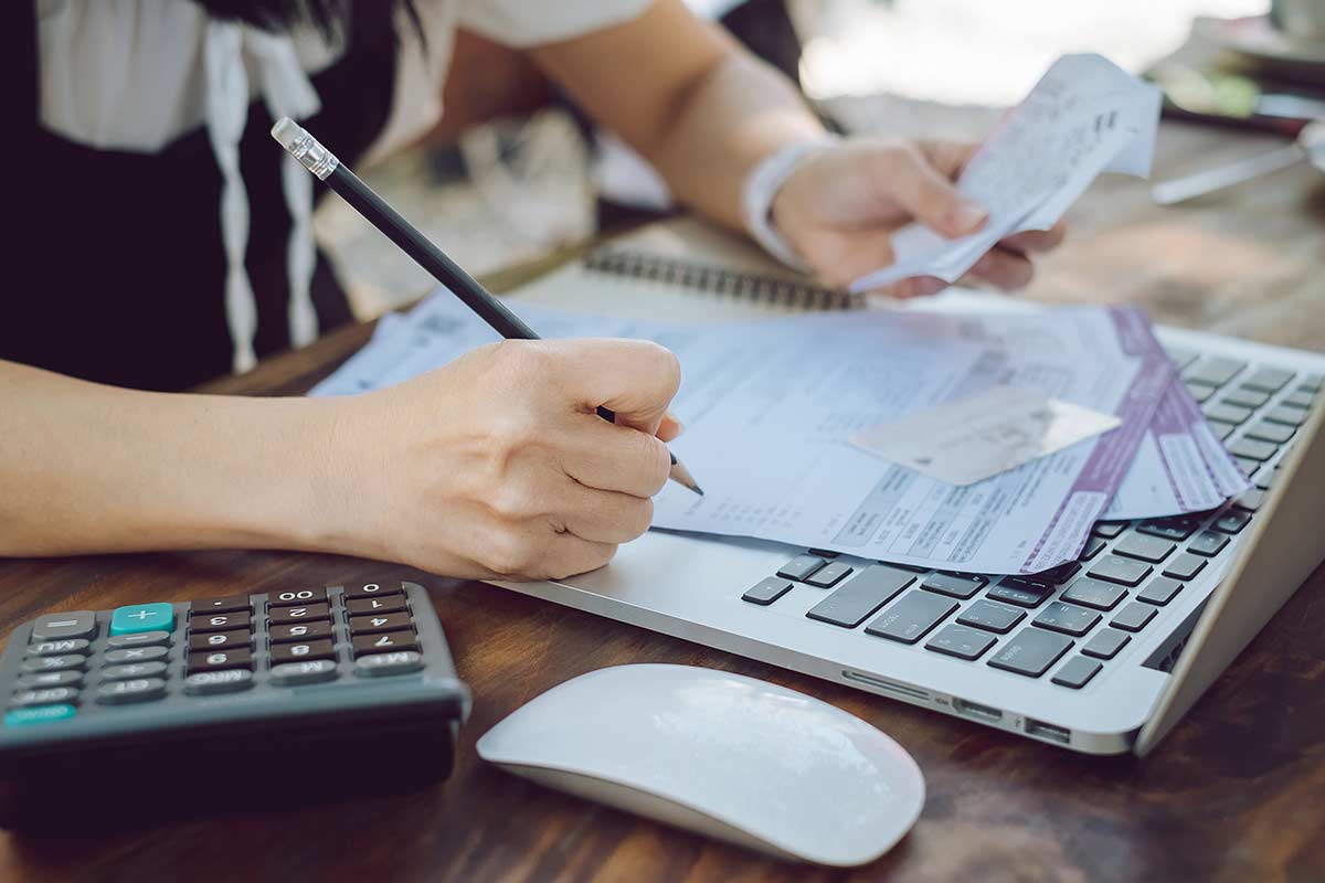 Woman checking credit card bills